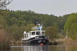 Residential boat on the Peene, Peene Valley River Landscape nature park Park, Mecklenburg-Western