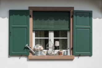 Window with green shutters and various decorative items, Seebach, Département Bas-Rhin, Alsace,