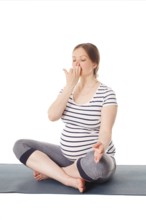 Pregnancy yoga exercise, pregnant woman doing yoga breathing exercise Pranayama isolated on white