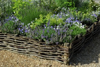 Flowerbed with willow fence