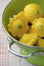 Patisson, mini patissons, in a colander (Cucurbita pepo) , pumpkin, bishop's mitre