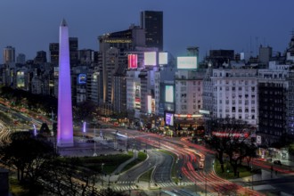 Traffic at the obelisk on Avenida 9 de Julio in the last daylight, blue hour, Buenos Aires,