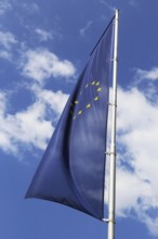 Flag of the European Union in front of a blue sky (Flag of the European Union in front of a blue