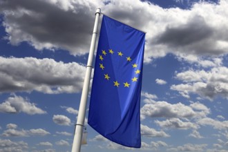 Flag of the European Union in front of a blue sky