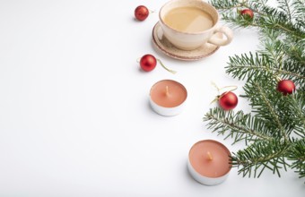 Christmas or New Year composition. Decorations, red balls, fir and spruce branches, cup of coffee,