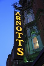 Arnotts department store shop sign at night, Dublin, Ireland, Republic of Ireland, Europe