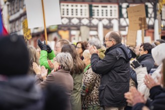 Group of people clapping at a public gathering, demonstration against the right, Nagold, Black