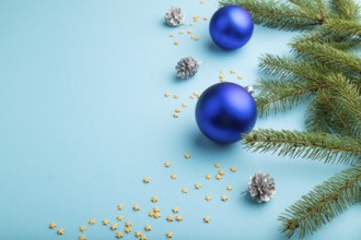 Christmas or New Year composition. Decorations, blue balls, cones, fir and spruce branches, on a