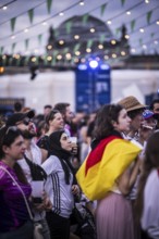 Scenes in the fan zone on Platz der Republik in front of the Reichstag building taken in Berlin, 29