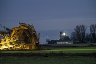 Two excavators are working around the hamlet of Lützerath, occupied by climate activists, the