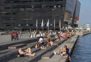 Summer, swimming in the harbour of Copenhagen, there are official bathing places, harbour baths and