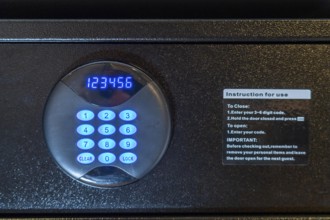 Room safe in a hotel, keypad for entering a 6-digit numerical code to lock the safe for depositing