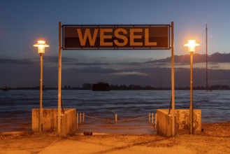 Rhine flood, riverside promenade in Wesel, the river water is already spilling onto the paths,