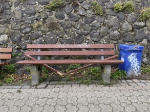 Vandalism, wilfully destroyed park bench, wooden bench, on a footpath, Duisburg, North