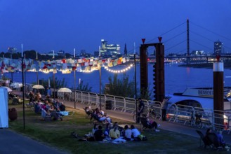 Skyline of Düsseldorf on the Rhine, sunset, city beach at the Theodor-Heuss-Bridge, temporary