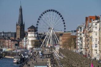 Rhine promenade in Düsseldorf, Ferris wheel, old castle tower, St Lambert's Basilica, old town,