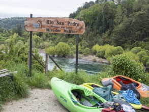 Kayaks on the banks of river Rio San Pedro, Mirador Malihue, Chile, South America