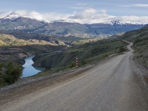 Road Carretera Austral north of Cochrane, gravel road along river Rio Baker, Patagonia, Chile,