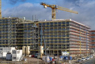 Large construction site, scaffolded shell of an office building complex, O-Werk Campus in Bochum,