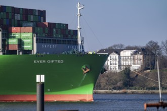 Container ship Ever Gifted, enters the port of Hamburg on the Elbe, shipping company Evergreen,