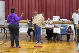 Detroit, Michigan USA, 5 November 2024, A voter gets his ballot for the 2024 presidential election