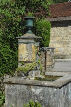 Old historical fountain with curved tap Water spout for permanent drinking water supply Clean