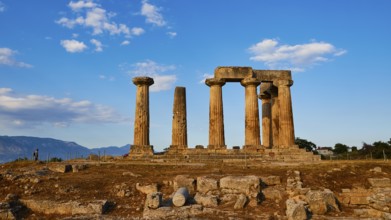 Archaic Temple of Apollo, Doric columns, Sunset light illuminates the columns and ruins of a