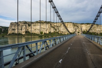 Old suspension bridge over the Rhone and rocks, Passerelle Marc Seguin, Tain-l'Hermitage,