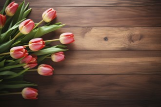 Top view of pink tulip spring flowers on side of wooden background with copy space. KI generiert,