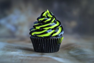 Halloween cupcake with bright neon green and black frosting. Generative Ai, AI generated