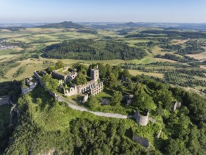 Aerial view of the volcanic cone Hohentwiel with Germany's largest fortress ruins, on the horizon