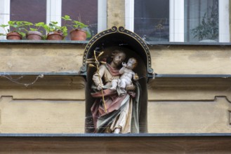 Healing figure on a residential and commercial building, Bamberg, Upper Franconia, Bavaria,