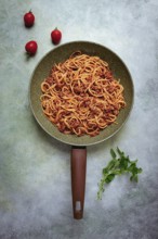 Spaghetti bolognese, in a frying pan, top view, homemade, no people