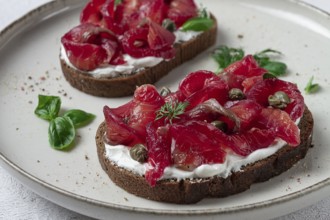 Sandwiches with gravlax salmon, cream cheese, capers, greens, breakfast, homemade