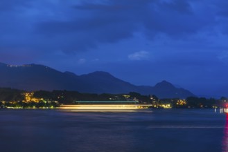 Nautical Vessel on Lake Lucerne in Long Exposure at Night with Mountain in Switzerland