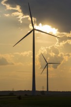 Wind farm, wind turbine, wind turbines, in front of sunset, storm clouds, Swabian Alb,