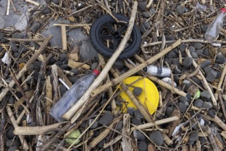 Symbolic image environmental pollution, plastic waste, rubbish, flotsam from a flood on the Neckar