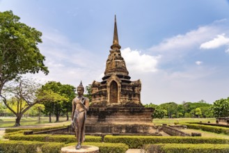 Buddha statue and chedi of the Buddhist temple Wat Sa Si, UNESCO World Heritage Sukhothai