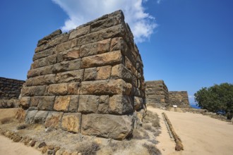 Ancient ruined wall in a dry landscape under a clear blue sky, Palaiokastro, Ancient fortress, 3rd