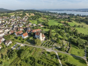 The church of St Johann and Vitus in Horn on the Höri peninsula, on the horizon the Hegau mountains