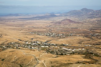 View of land and villages in barren interior of Fuerteventura, Canary Islands, Spain, Europe