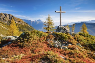 View of the Valais mountains and the Rhone valley with summit cross in autumn, Lower Valais,