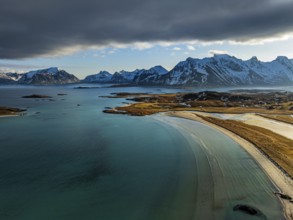 Aerial view of beach and mountains, coast, winter, sun, backlight, Moskenesoya, Lofoten, Norway,