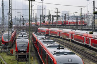 Railway tracks with regional trains, after freezing rain, in front of Frankfurt main station,