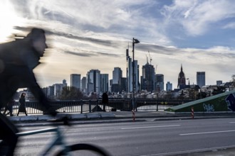 Skyline of Frankfurt am Main, skyscrapers, cyclists on the Flößerbrücke, Hesse, Germany, Europe