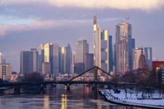 The skyline of Frankfurt am Main, skyscrapers of the banking district, Flößerbrücke, wintry