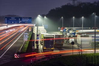 Heavy traffic on the A2 at the Schwarze Heide rest area, Bottrop, overcrowded car park for trucks