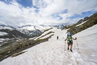 Two mountaineers crossing a snowfield, ascent to the Nördliche Mörchnerscharte, mountain peak with