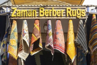 Traditional Berber rugs hanging on display outside shop in medina area of Essaouira, Morocco, north