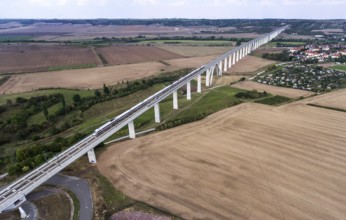 An aerial photo shows an ICE train travelling over the Unstruttal bridge near Karsdorf. The